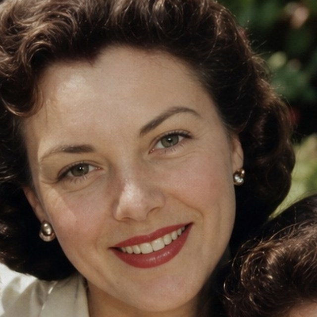 Zoomed detail of the mother’s eyes and smile after restoration